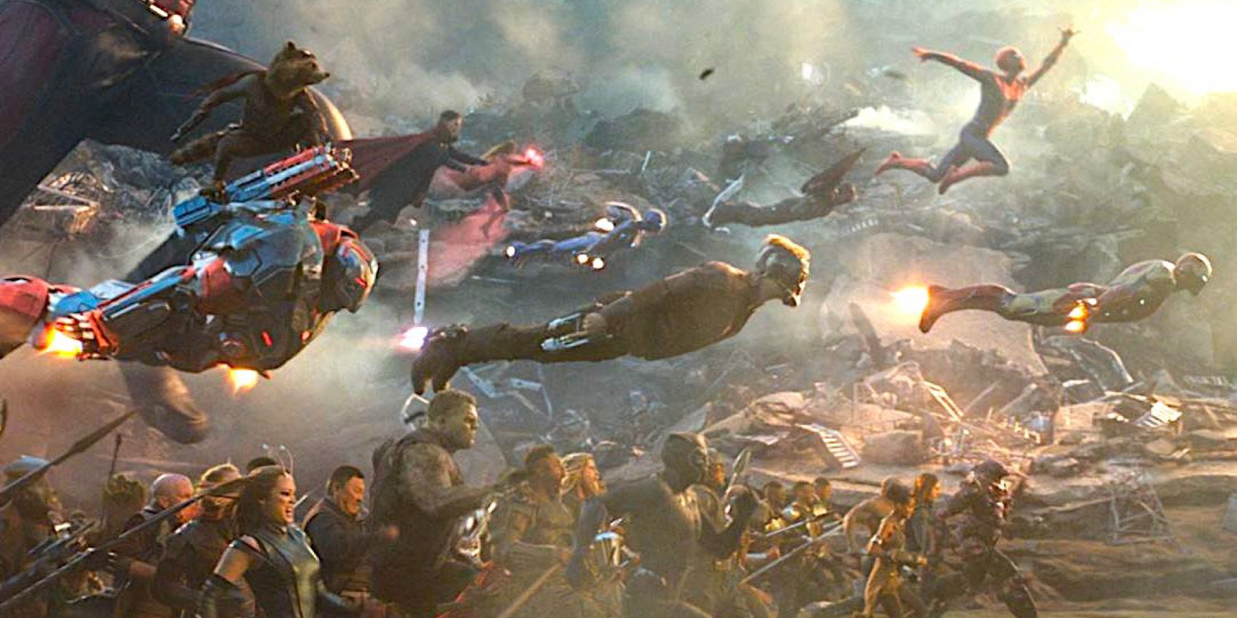 A horde of Superheroes, the Avengers and their resurrected friends, charge en masse amidst the wreckage of their decimated compound in Avengers: Endgame.