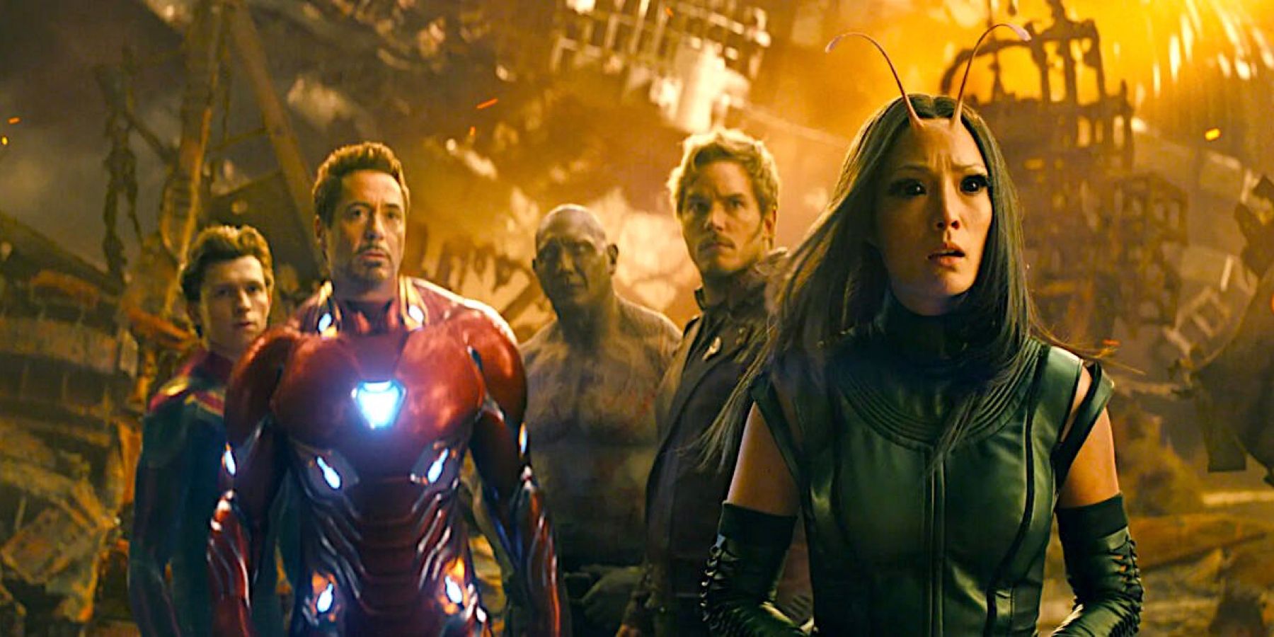 Spider-Man (Tom Holland), Iron Man (Robert Downey Jr.), Drax (Dave Bautista), Star-Lord (Chris Pratt), and Mantis (Pom Klementieff), look wary on the surface of the planet Titan in Avengers: Infinity War.