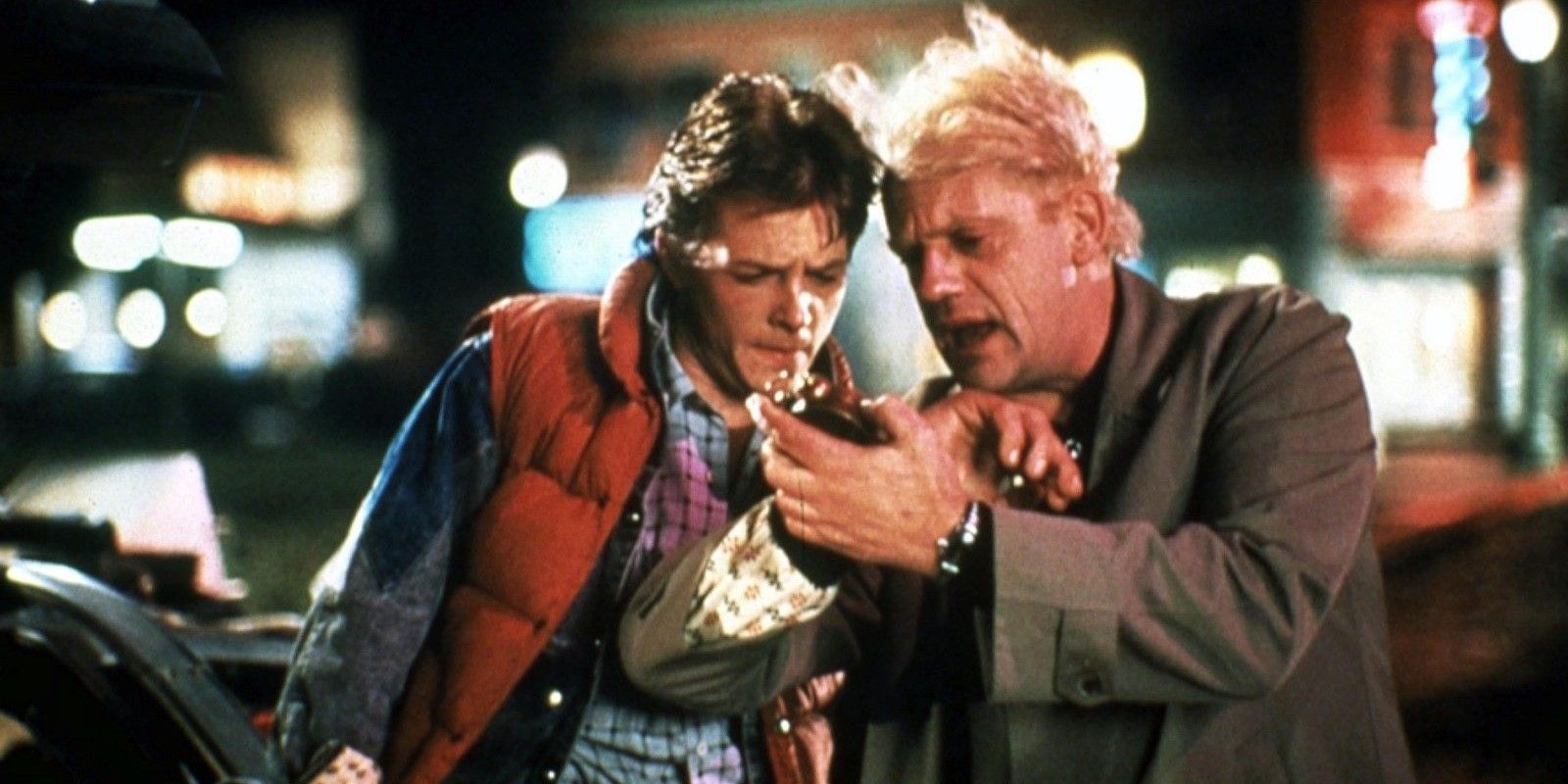 Marty McFly and Doc Brown look at a watch in 'Back to the Future'