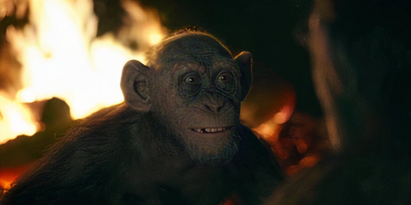 Bad Ape (Steve Zahn) smiles in front of a fire in 'War for the Planet of the Apes'