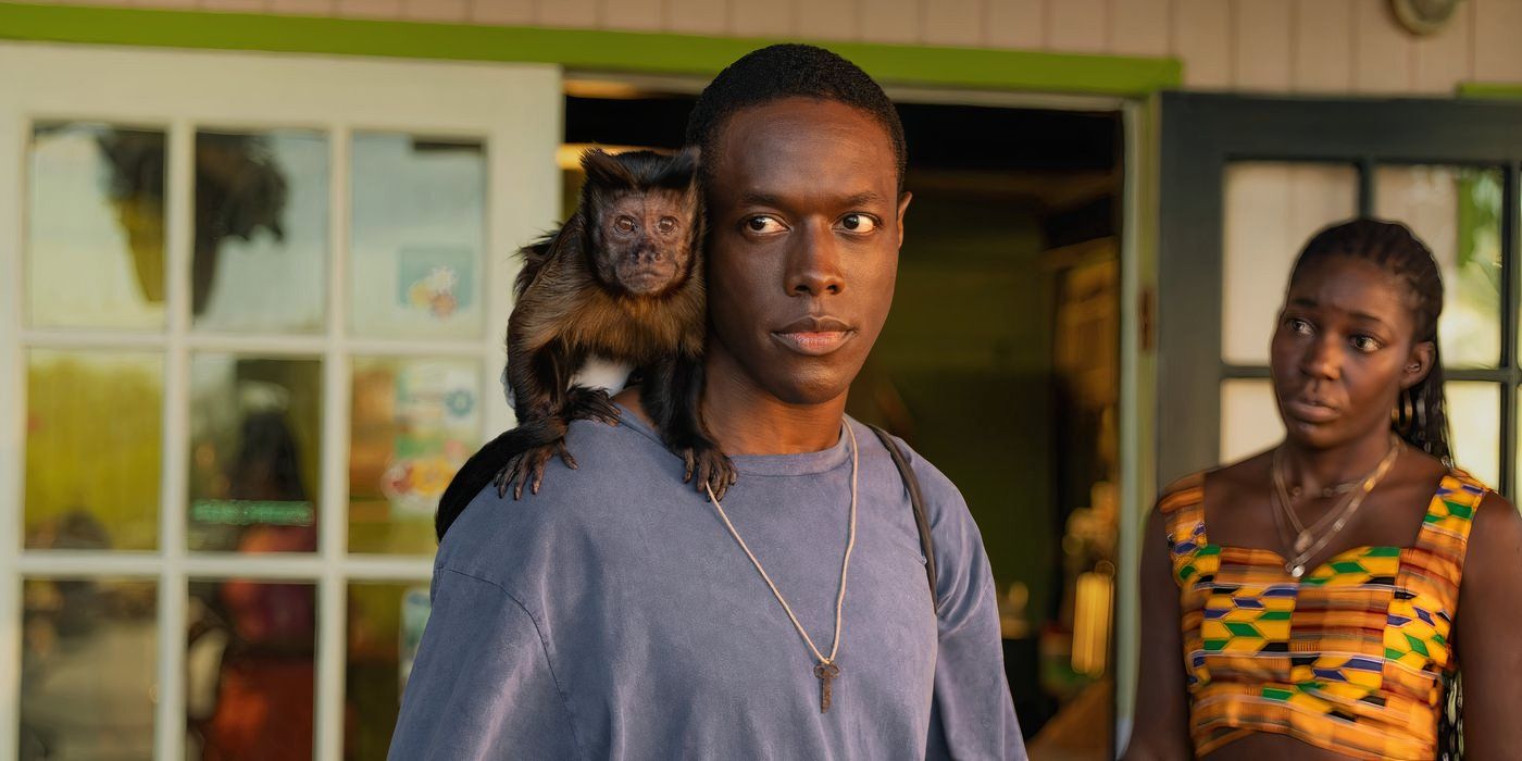 Ronald Peet holds the titular monkey on his shoulder in ‘Bad Monkey’