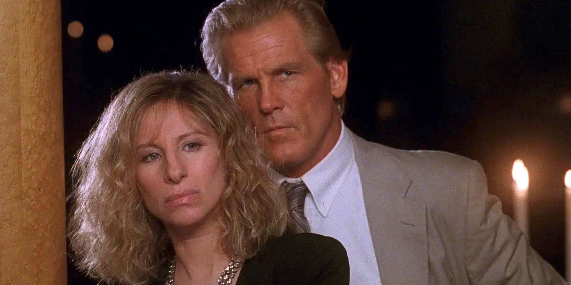Barbra Streisand standing in front of Nick Nolte in The Prince of Tides (1991)