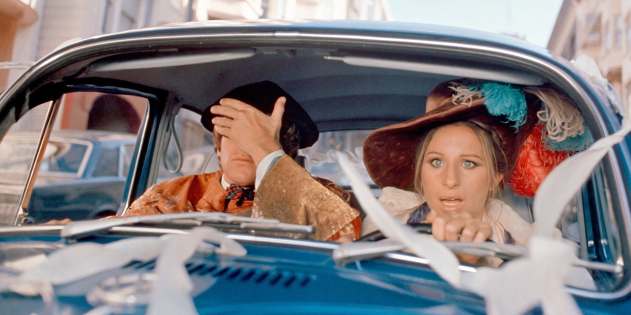  Howard covers his eyes while Judy drives and looks shocked in 'What's Up, Doc?'