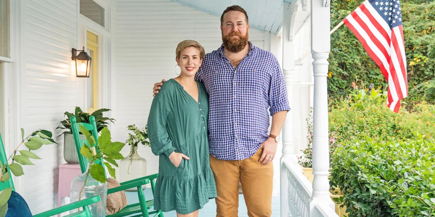 Ben and Erin Napier pose for a photo on a porch with green rocking chairs in Home Town