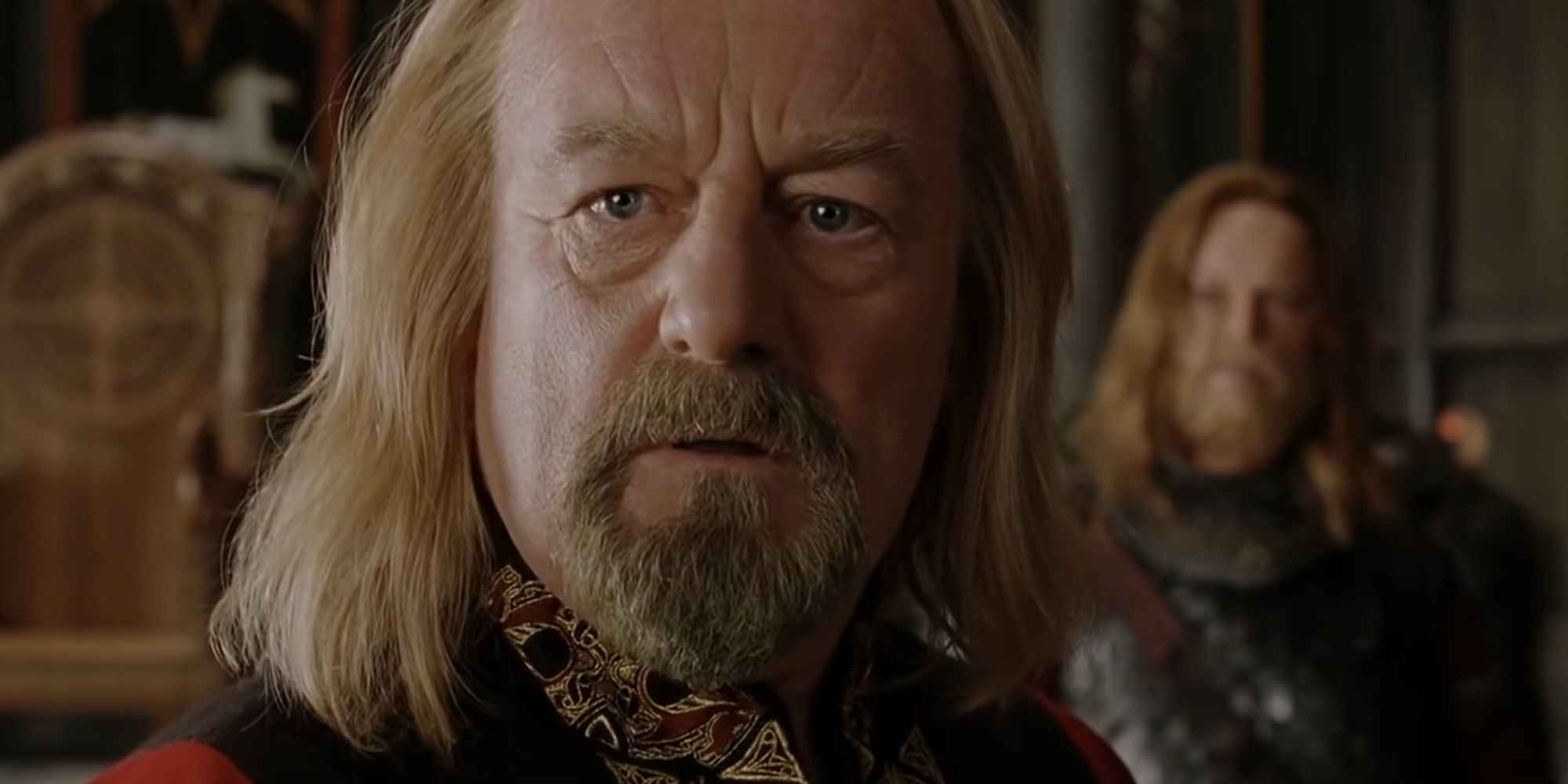 Close-up of Bernard Hill as Theoden, looking surprised, with a soldier in the background.