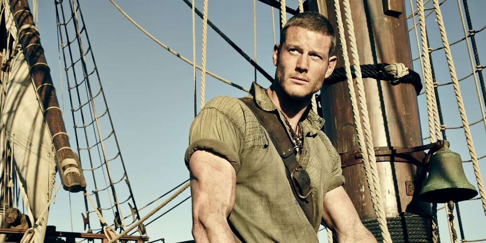 Tom Hopper, as Billy Bones, gazes into the distance from a ship in Black Sails