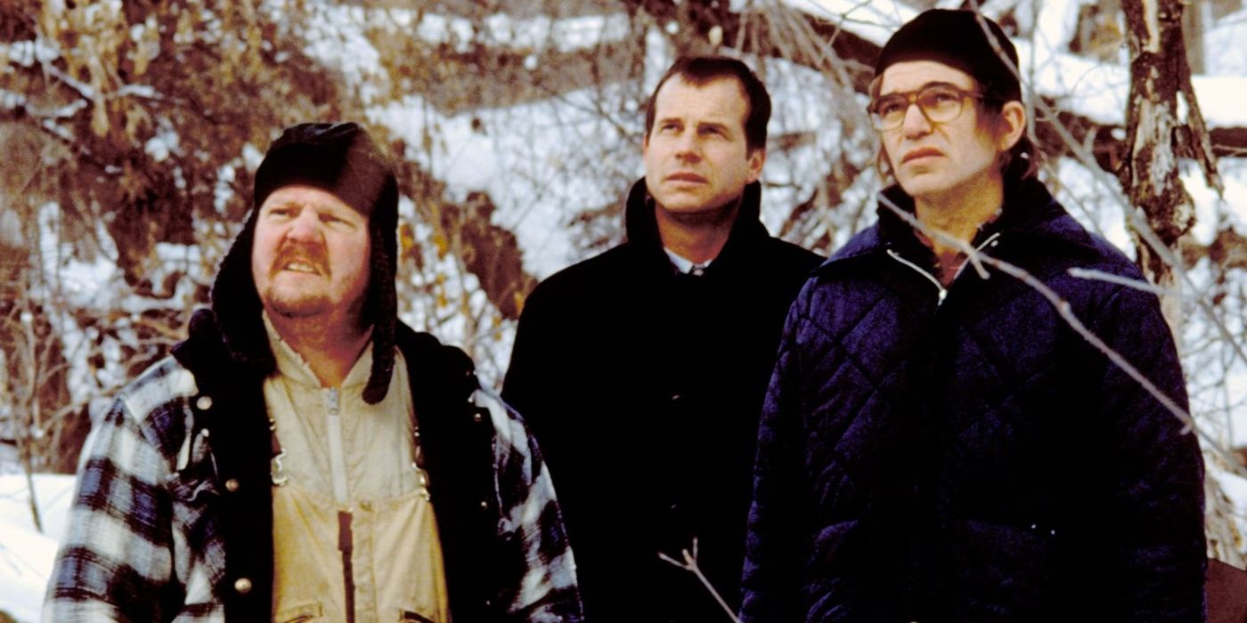 Lou, Hank, and Jacob standing in the snow looking intently ahead in A Simple Plan