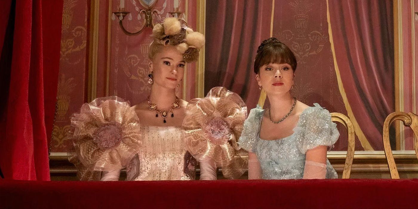 Cressida Cowper and Eloise Bridgerton sitting together and looking in the same direction in 'Bridgerton.'