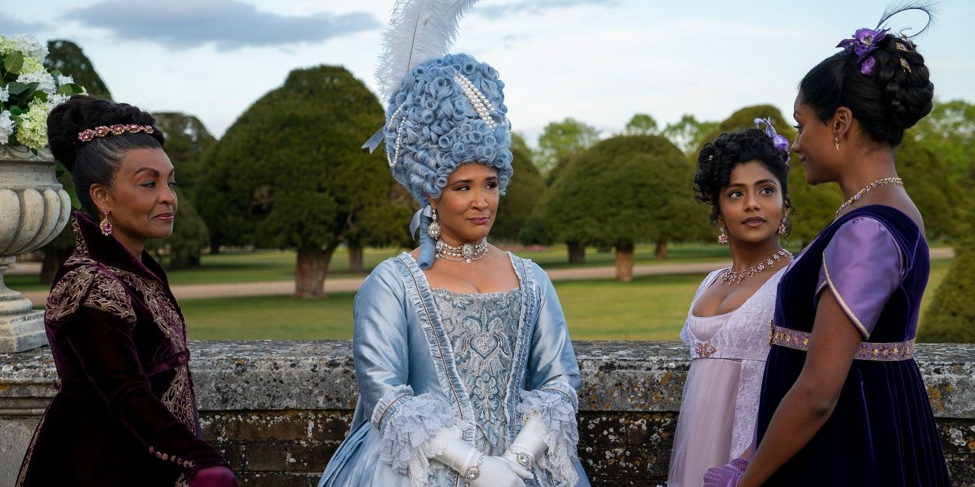 Adjoa Andoh and Golda Rosheuvel talking to the Sharma sisters outside in Bridgerton Season 2