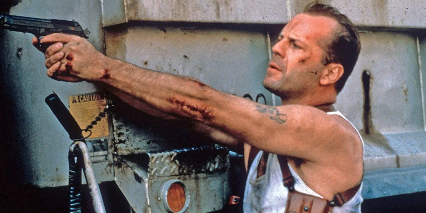 Bruce Willis as John McClane pointing his gun at a person offscreen in Die Hard with a Vengeance.