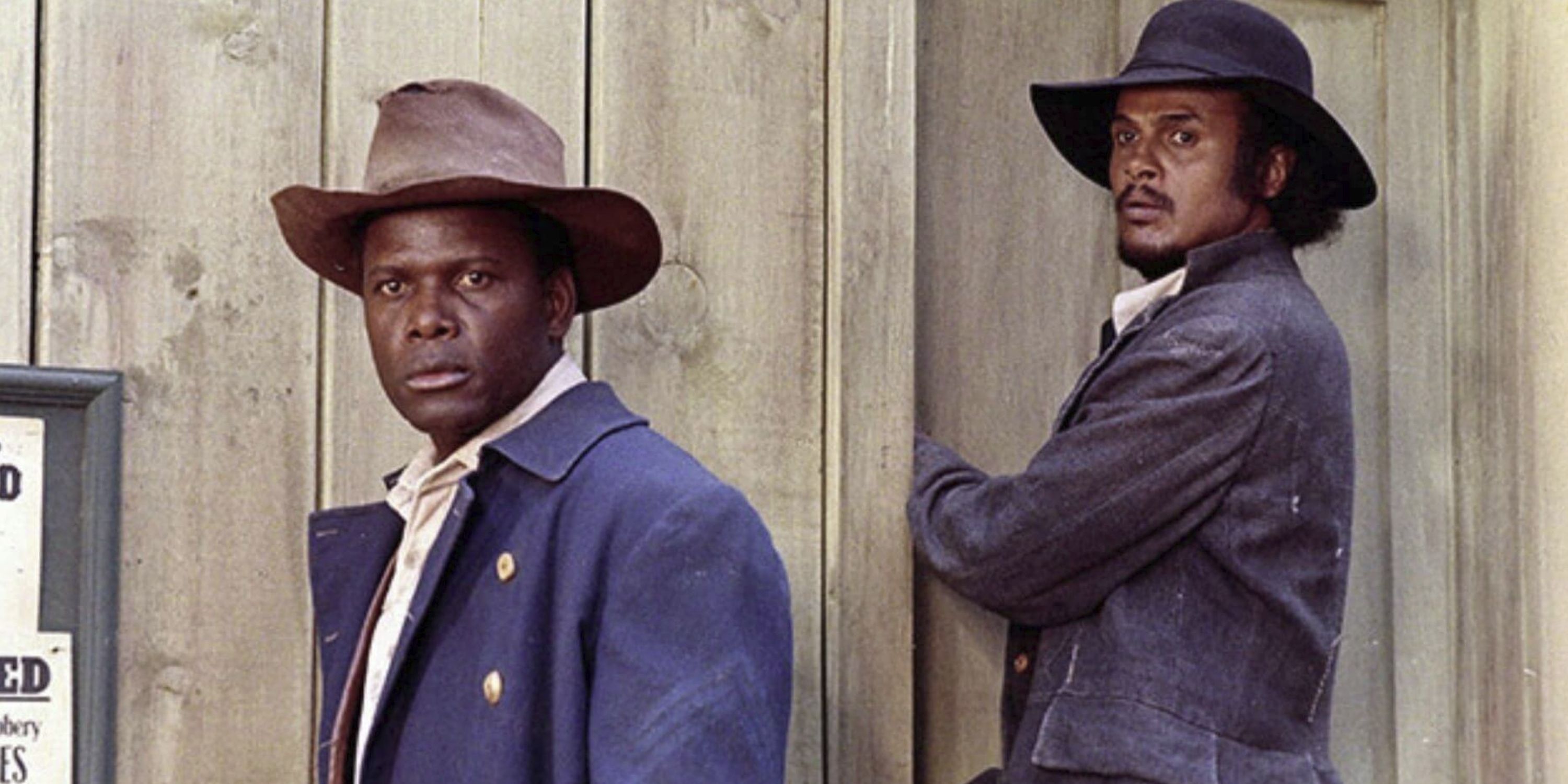 Sidney Poitier as Buck and Harry Belafonte as Preacher looking at something off camera in Buck and the Preacher