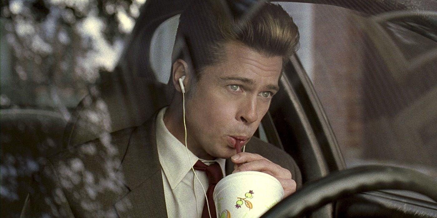 Brad Pitt as Chad Feldheimer drinking a milkshake in his car in Burn After Reading Movie