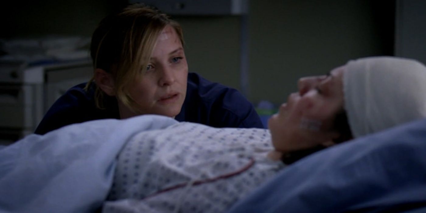 Arizona looking distressed as she sits by an unconscious Callie's bedside 