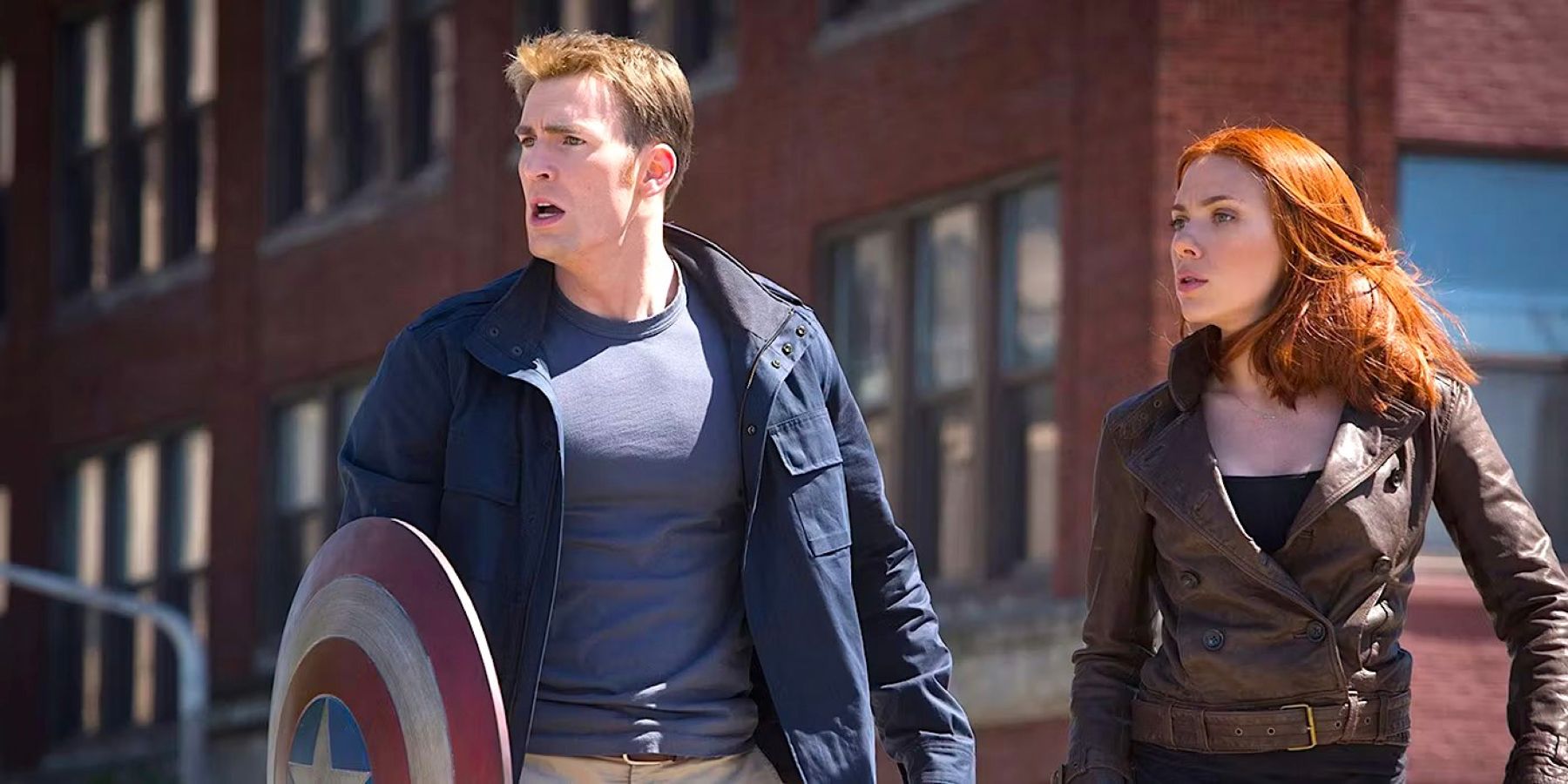 Captain America (played by actor Chris Evans) and Black Widow (played by actor Scarlett Johansson), catch their breath in the middle of a street fight in Captain America: The Winter Soldier.