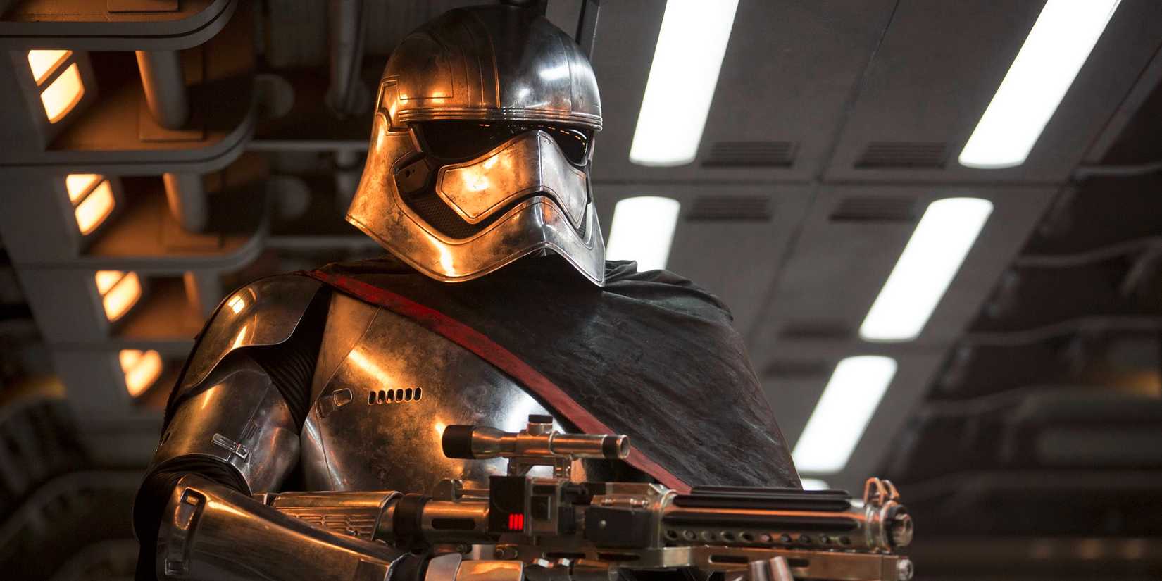 Captain Phasma, played by Gwendoline Christie, stands with a blaster in 'Star Wars: The Force Awakens'.
