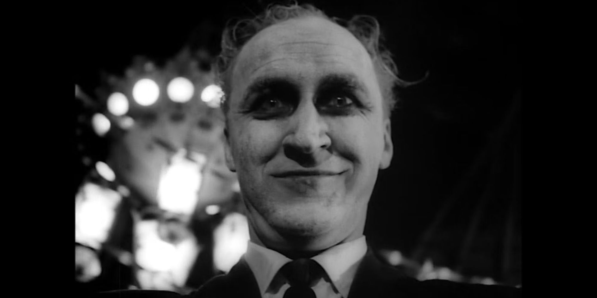 A sinister-looking man looking at the camera in Carnival of Souls