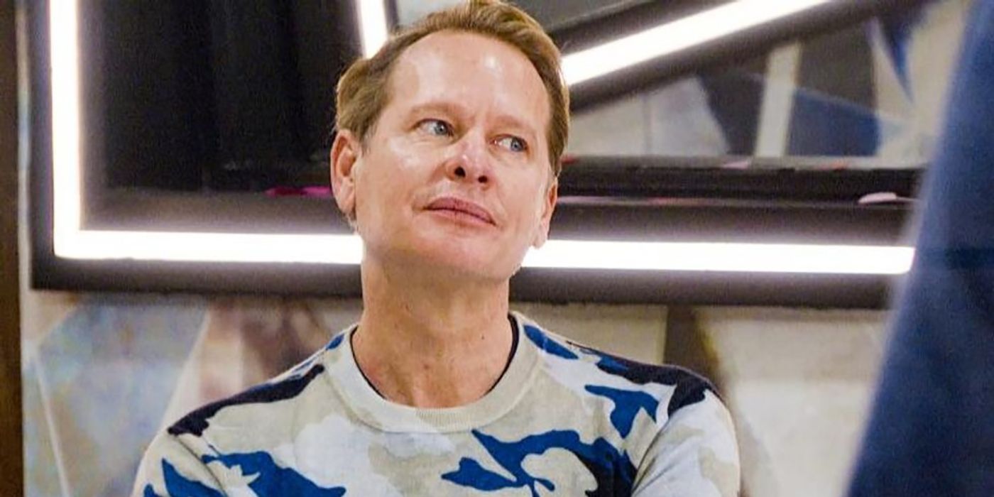  Carson Kressley on Celebrity Big Brother looking at someone on the side, pursing his lips.