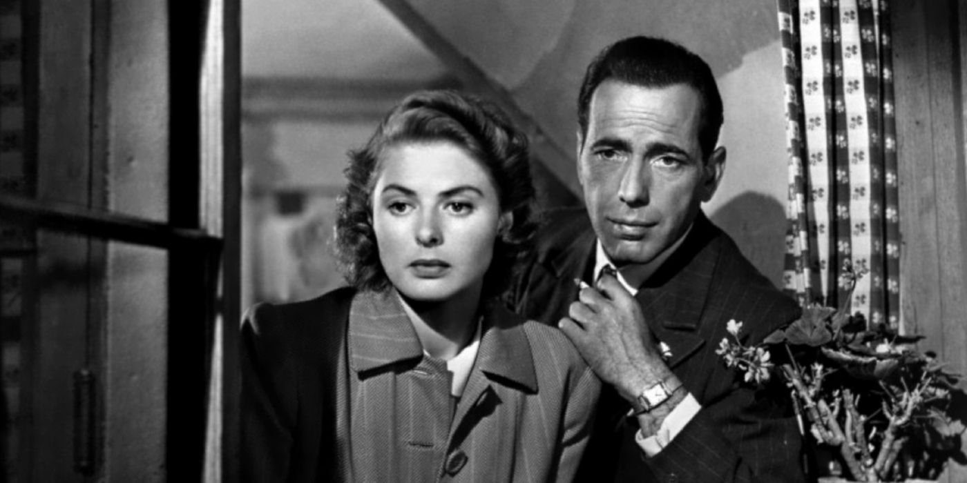 Rick next to Ilsa looking outside a window in 'Casablanca'.