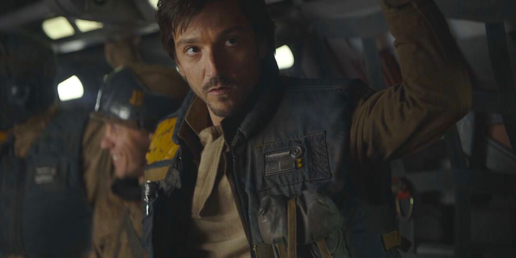 Cassian Andor (played by actor Diego Luna), holds on as a U-Wing takes flight in Rogue One: A Star Wars Story.