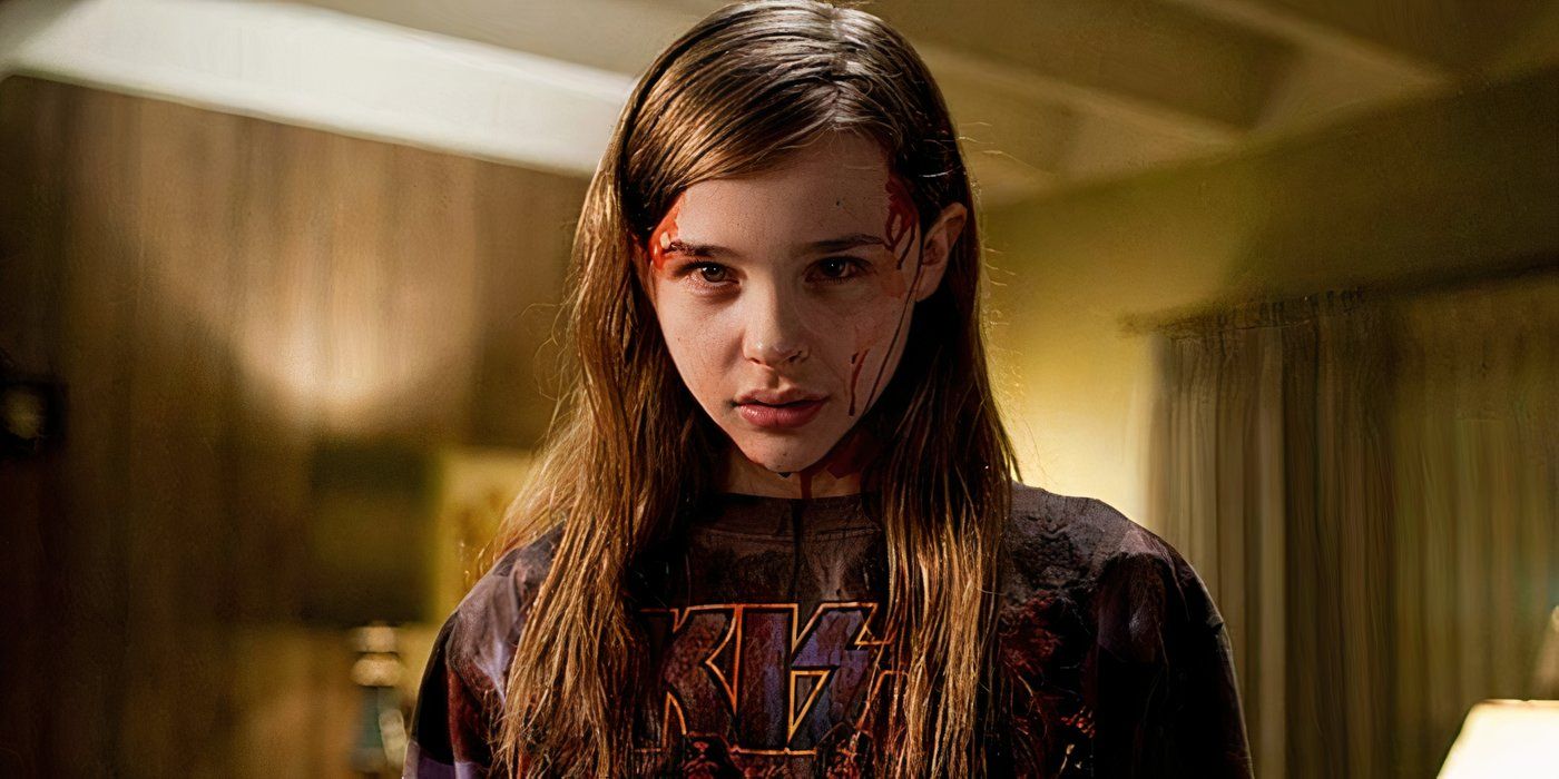 Abby looking intently with a somber expression in Let Me In
