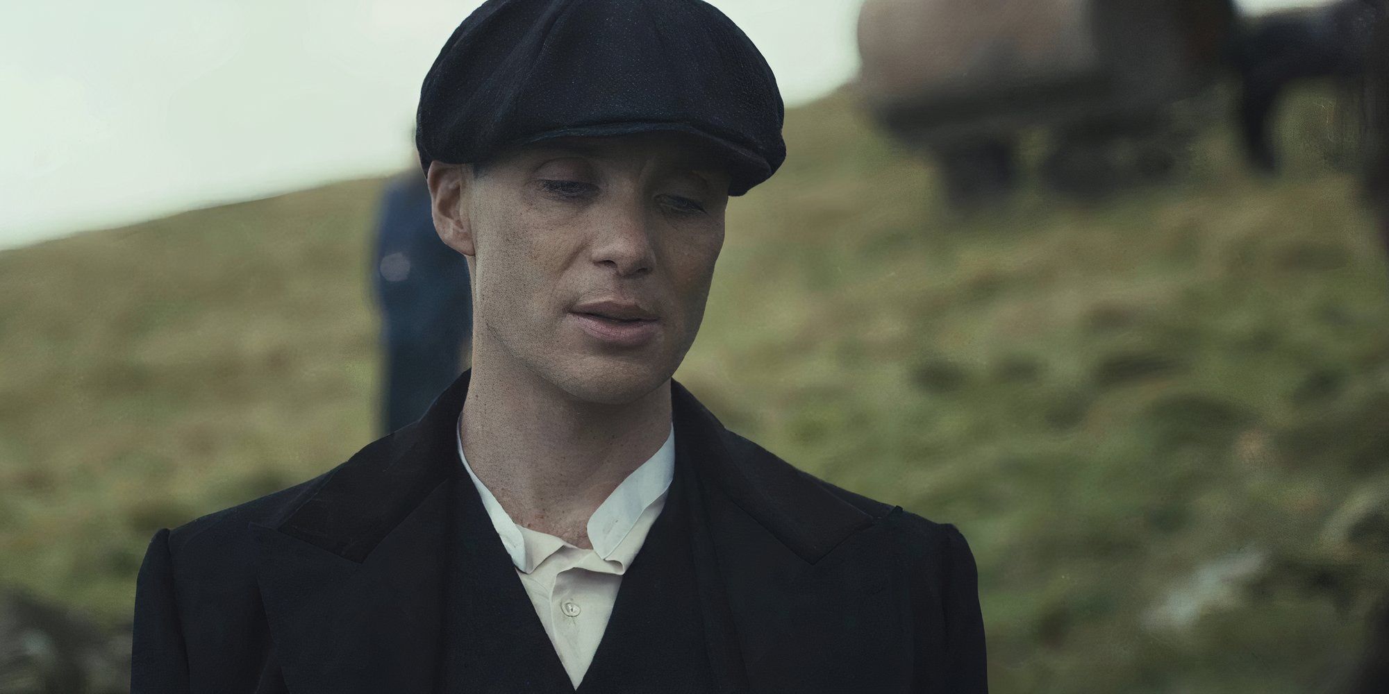 Cillian Murphy as Tommy Shelby in Peaky Blinders looking at the floor.