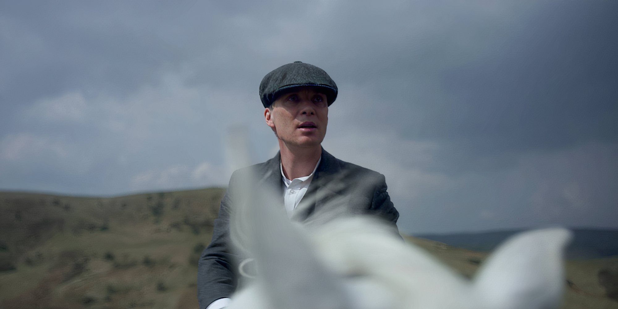 Cillian Murphy riding a horse in Peaky Blinders.