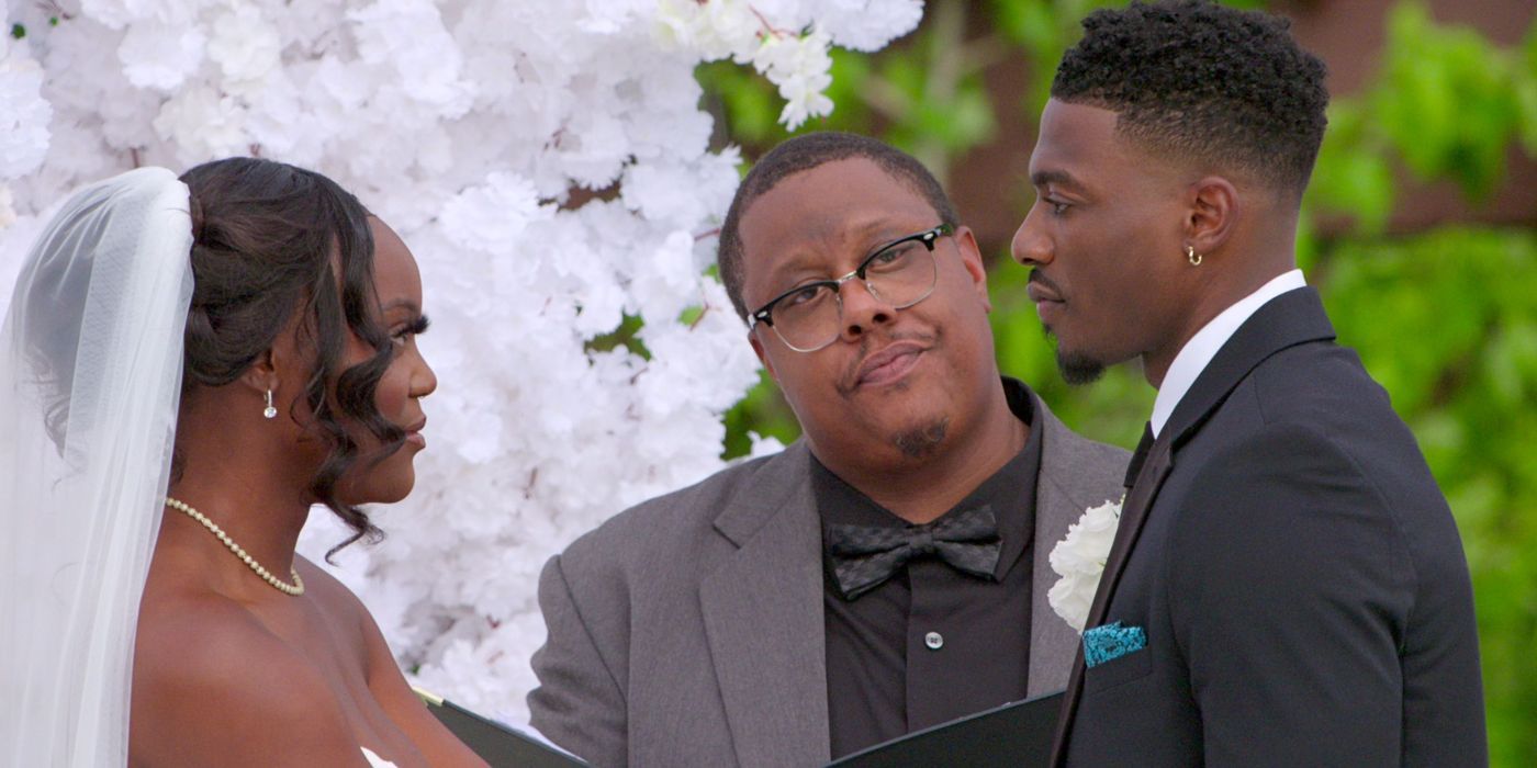 Clay Gravesande in a tux and AD Smith in a wedding dress, at the altar on their wedding day on Love is Blind.