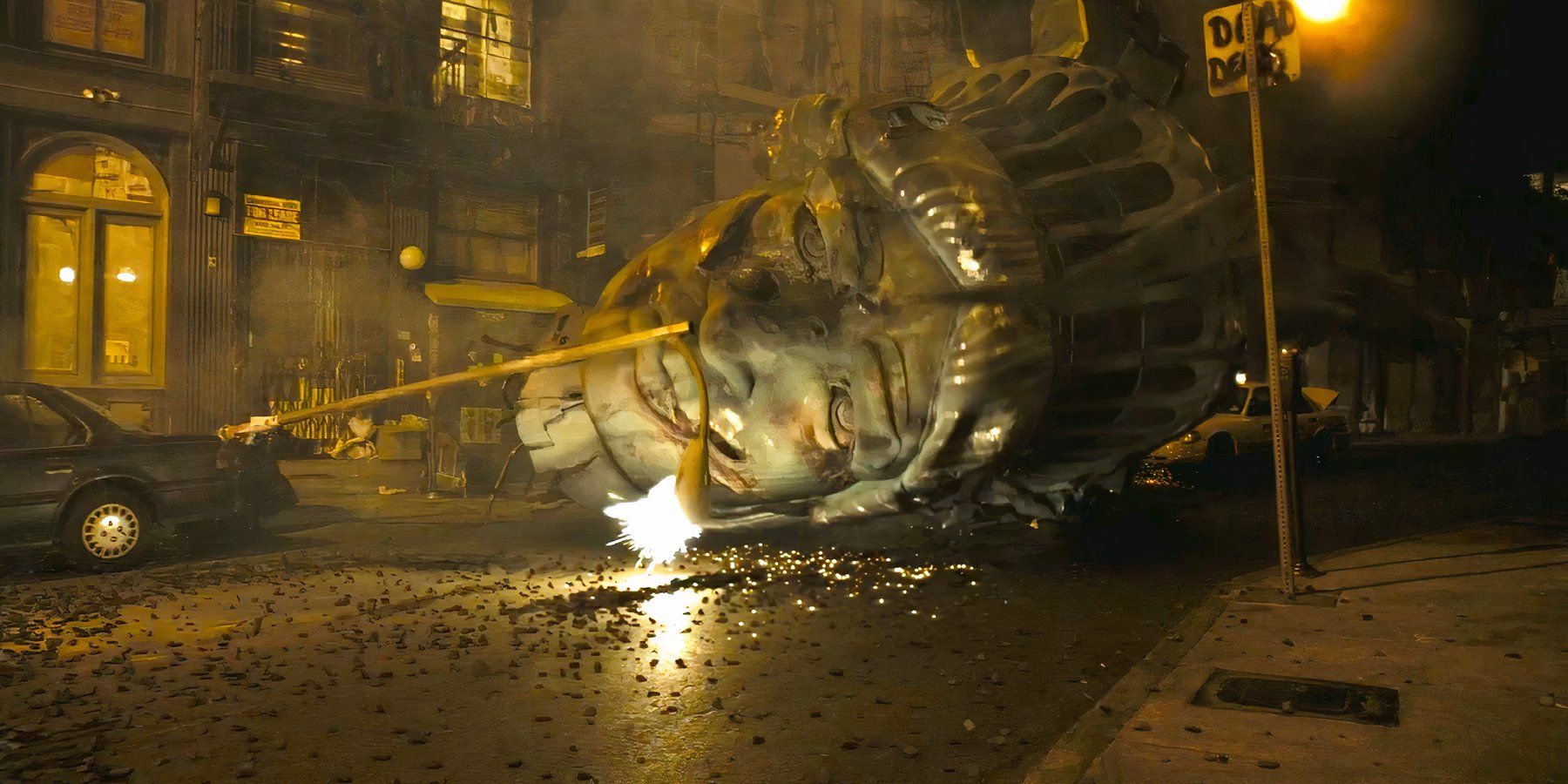 The decapitated head of the Statue of Liberty, scraped and scorched, lies discarded in the middle of a New York City street in Cloverfield.