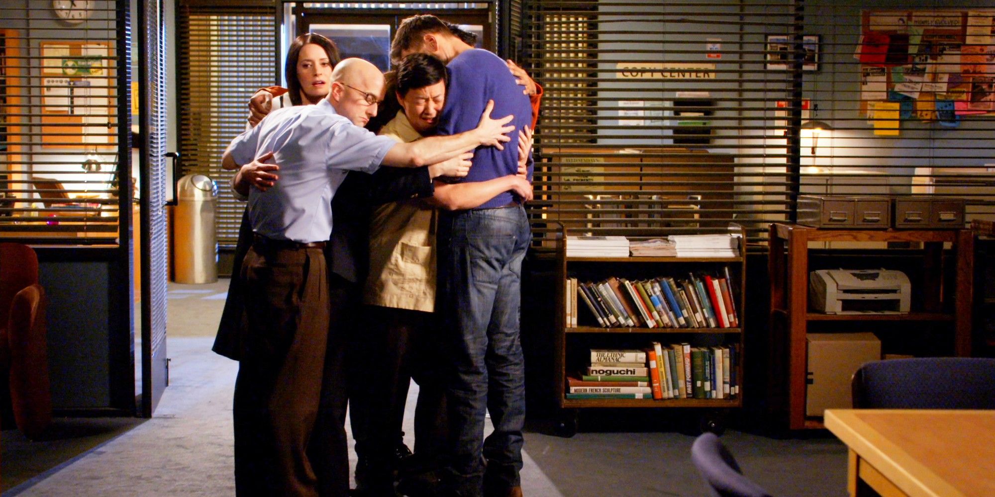 The Save Greendale Committee hugging in the series finale of Community