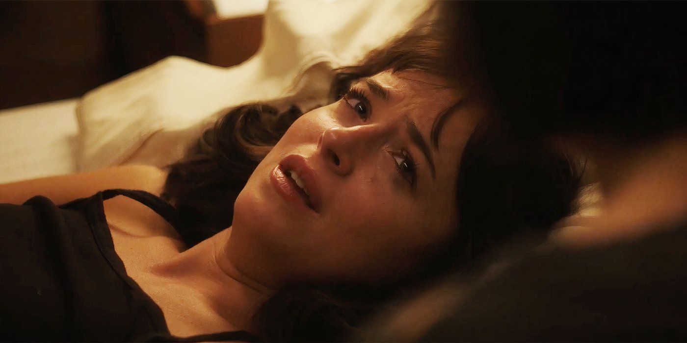 Dakota Johnson laying in a bed in Am I Okay?