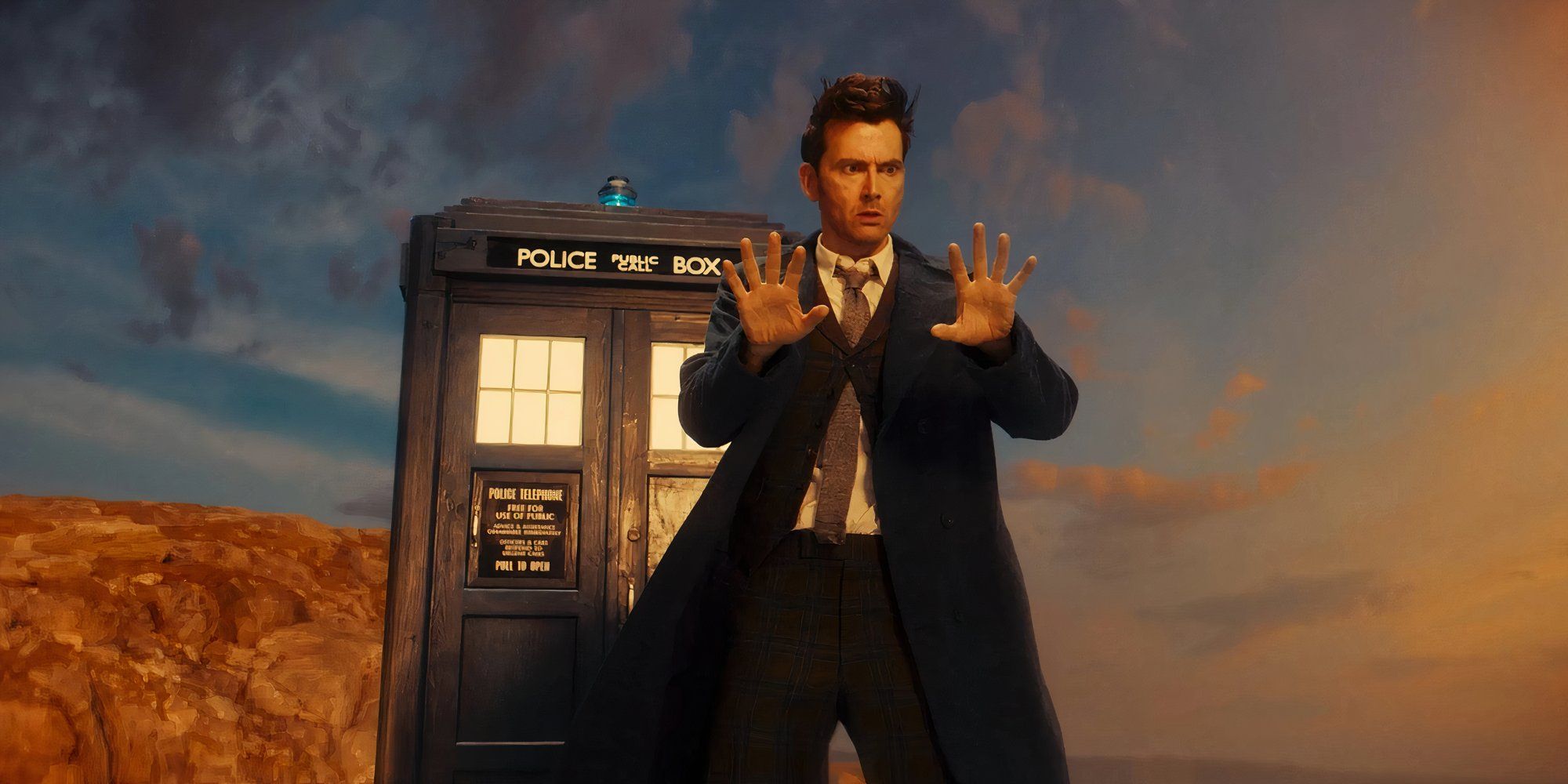 David Tennant as the 14th Doctor outside TARDIS, looking at his hands