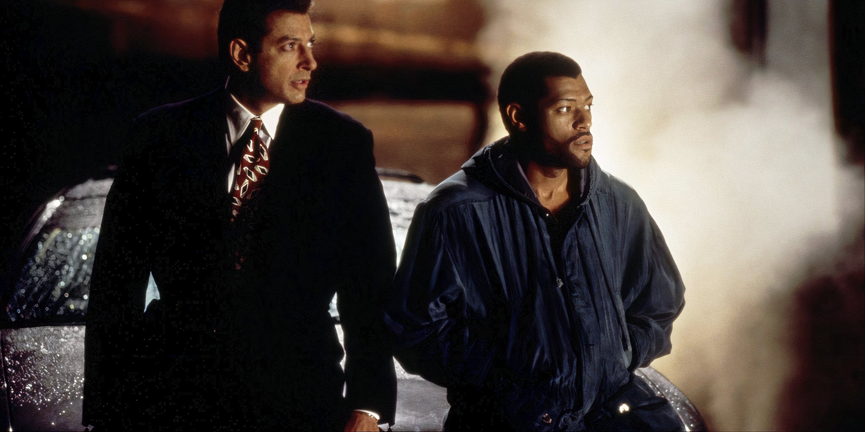 Jeff Goldblum and Laurence Fishburne looking at something off-camera in Deep Cover