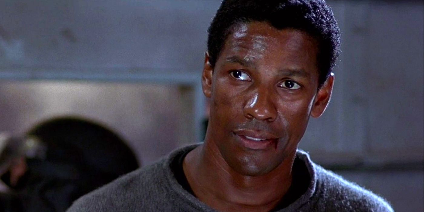 Denzel Washington as Parker Barnes, bloodied &amp; bruised, while looking at a person offscreen in Virtuosity