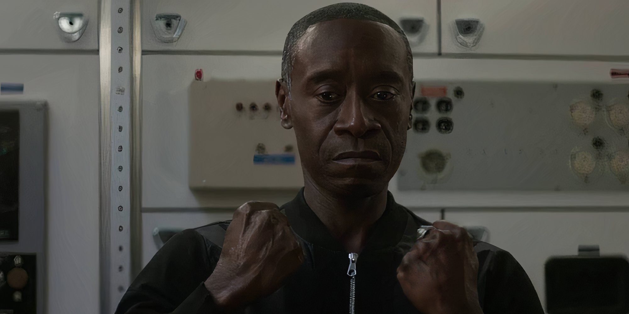 Don Cheadle as Rhodey in Avengers Endgame with his fists clenched.