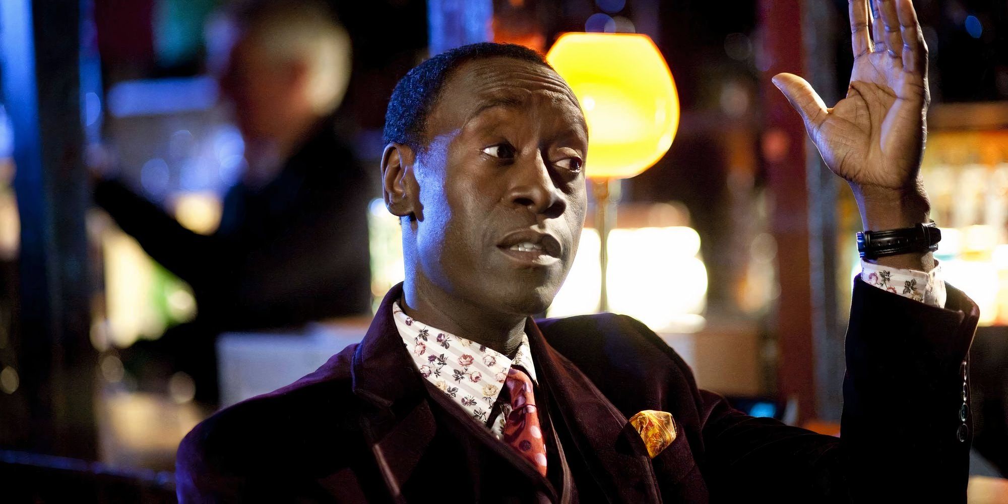 Don Cheadle as a FBI agent in The Guard with his hand in the air.