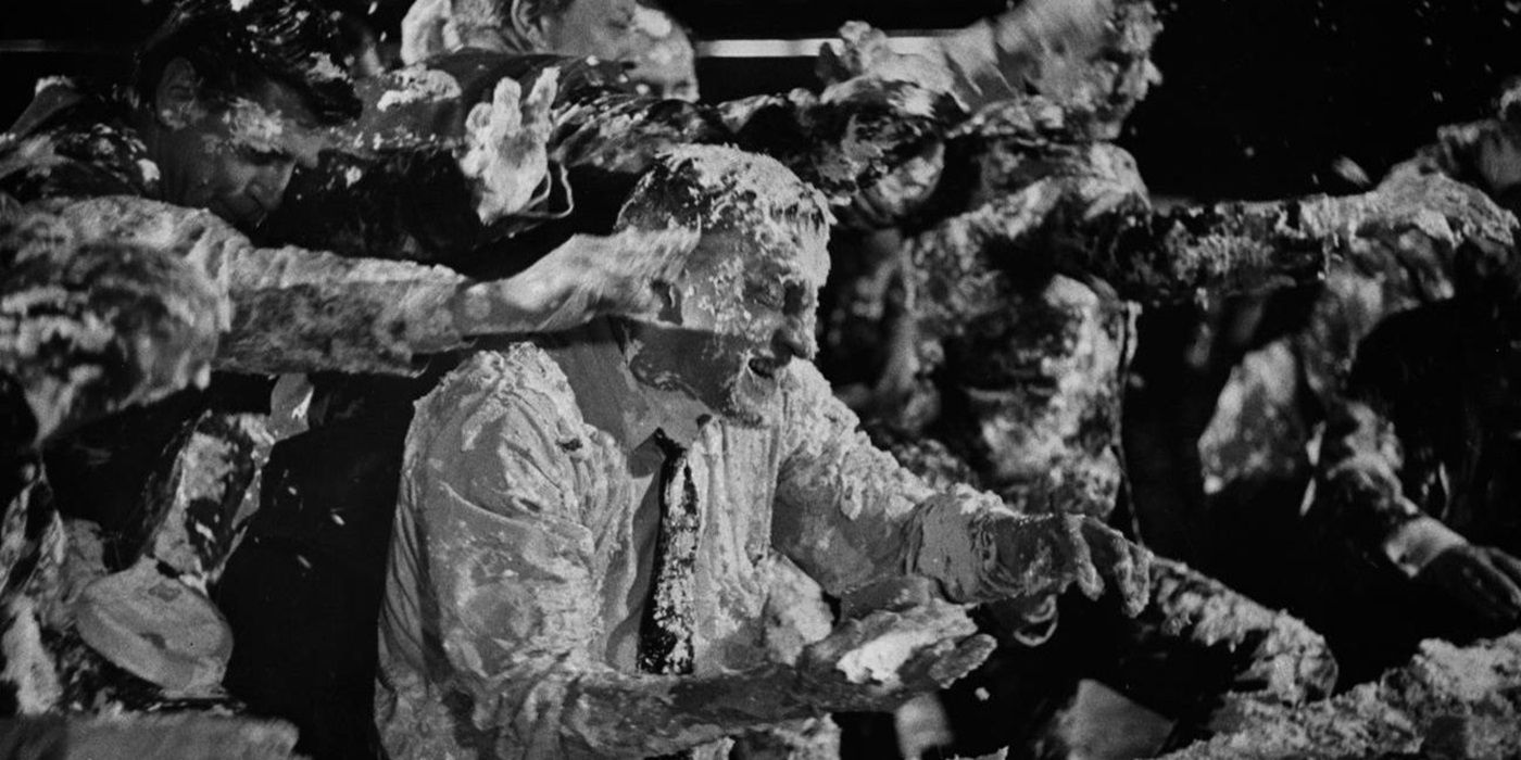 Ensemble cast of Dr. Strangelove in a custard pie fight in the alternate ending of the Stanley Kubrick movie