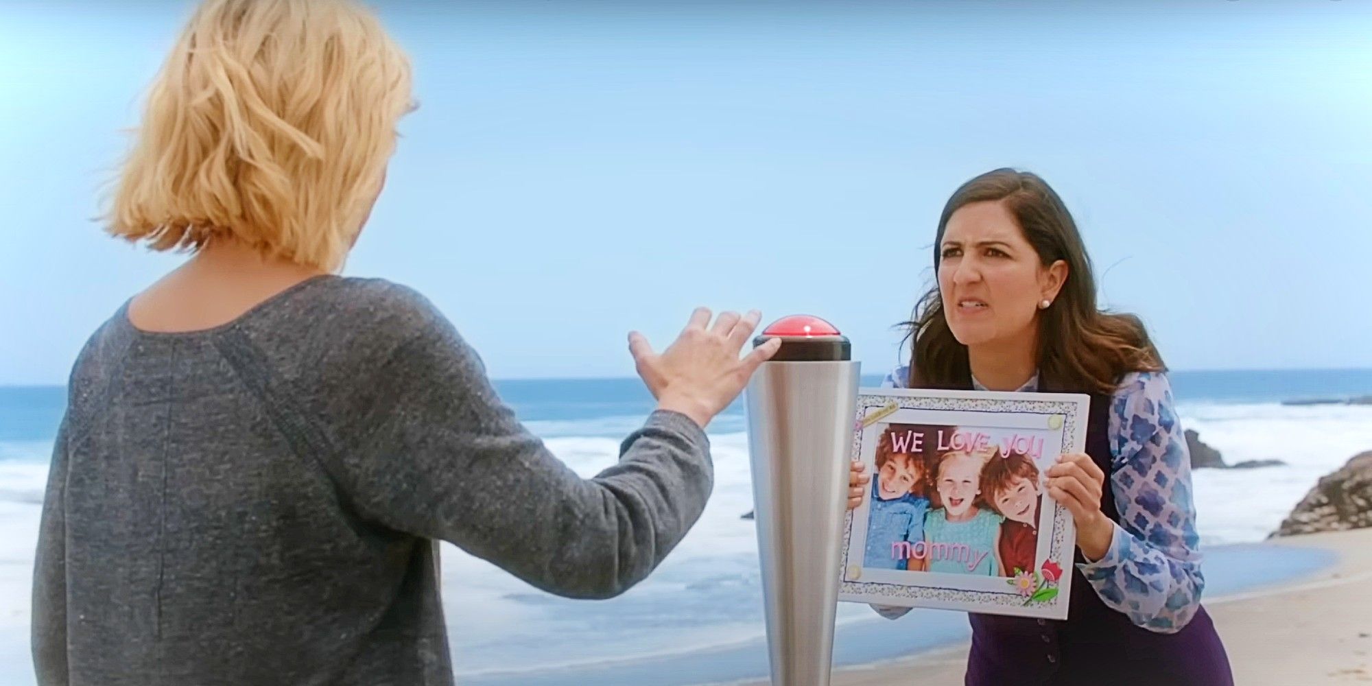 Eleanor Shellstrop pressing the button to kill Janet, who is holding a photo of three kids that says "WE LOVE YOU MOMMY" on The Good Place