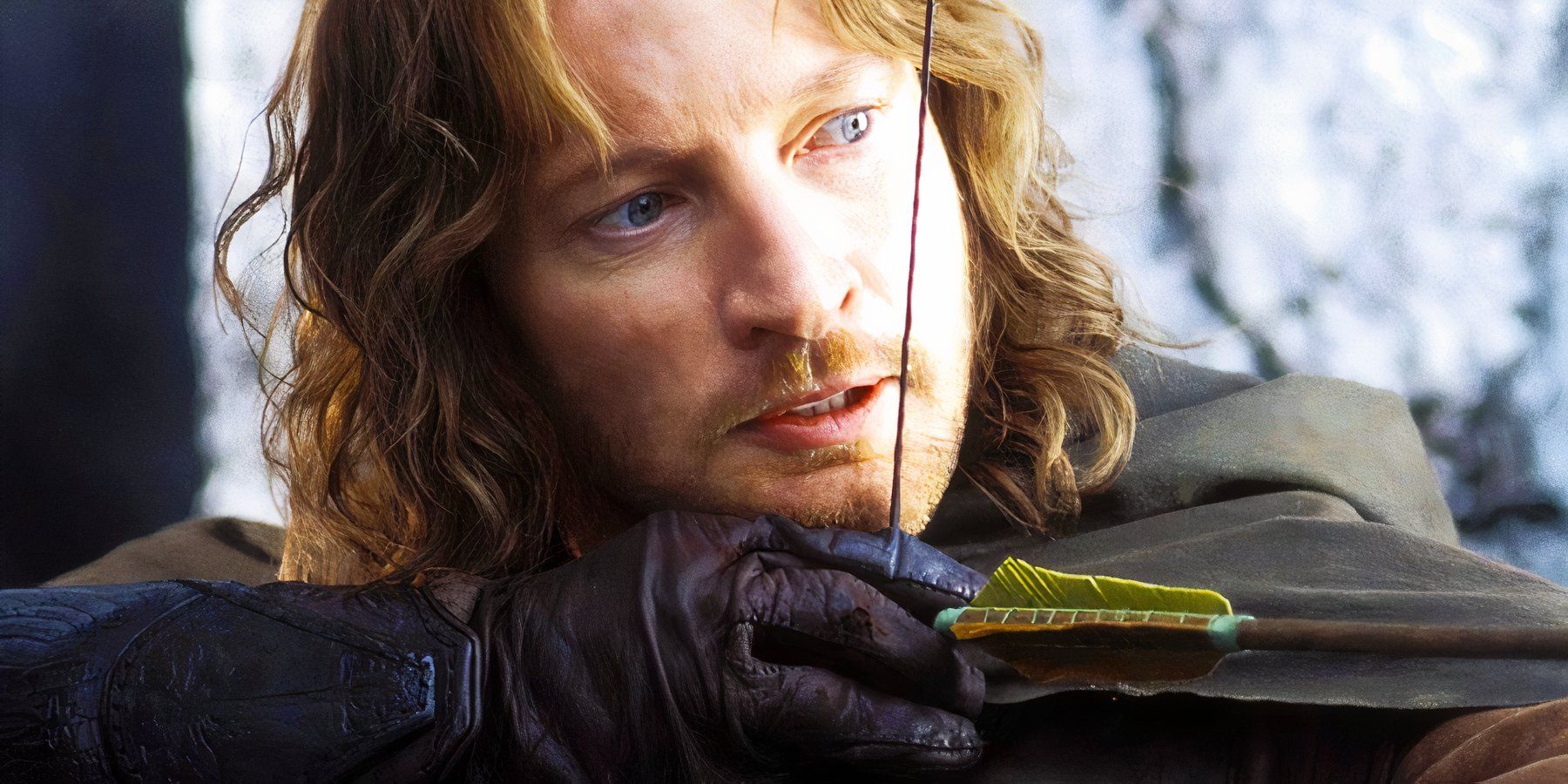 Bearded Faramir, played by actor David Wenham, notches an arrow to his bow, ready to fire in The Lord of the Rings: The Two Towers.