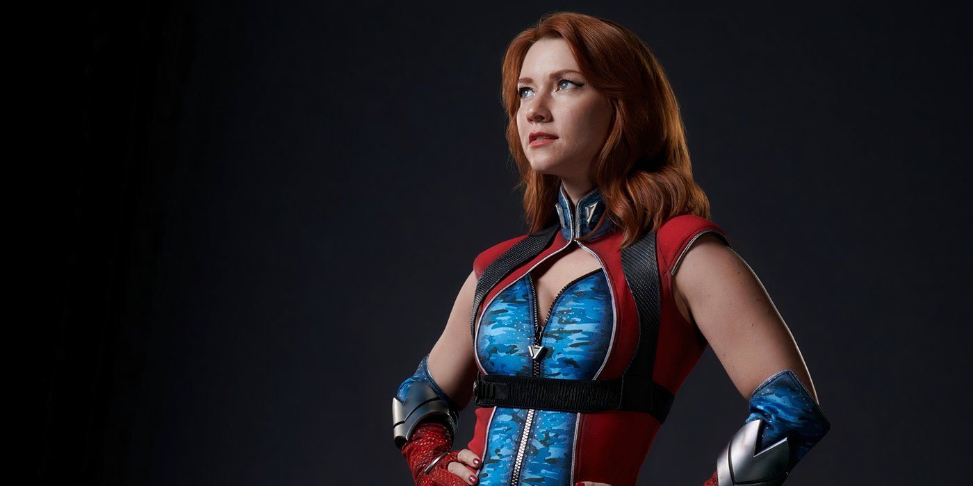 Valorie Curry as Firecracker, wearing her supersuit with her hands on her hips in a promotional photo for The Boys Season 4