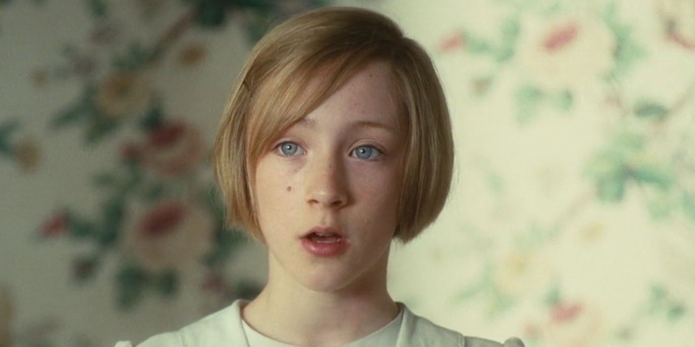 Saoirse Ronan as Briony Tallis in the middle of a conversation with someone off-camera in Atonement.