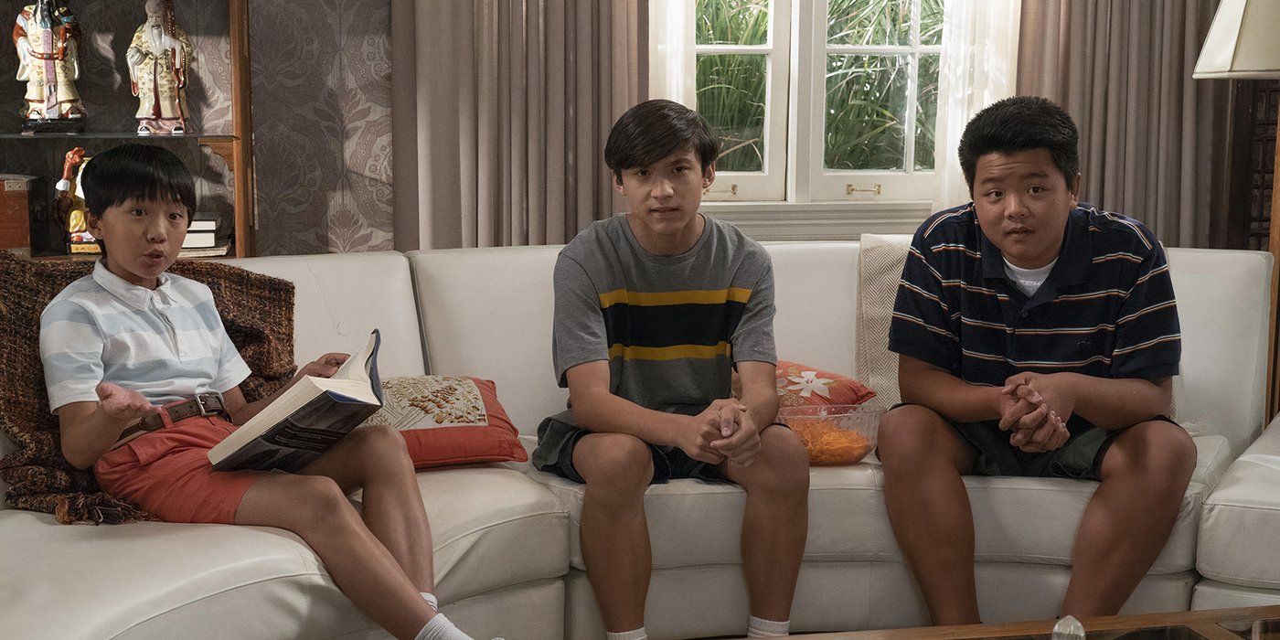 The three kids from Fresh off the Boat sitting on the couch.