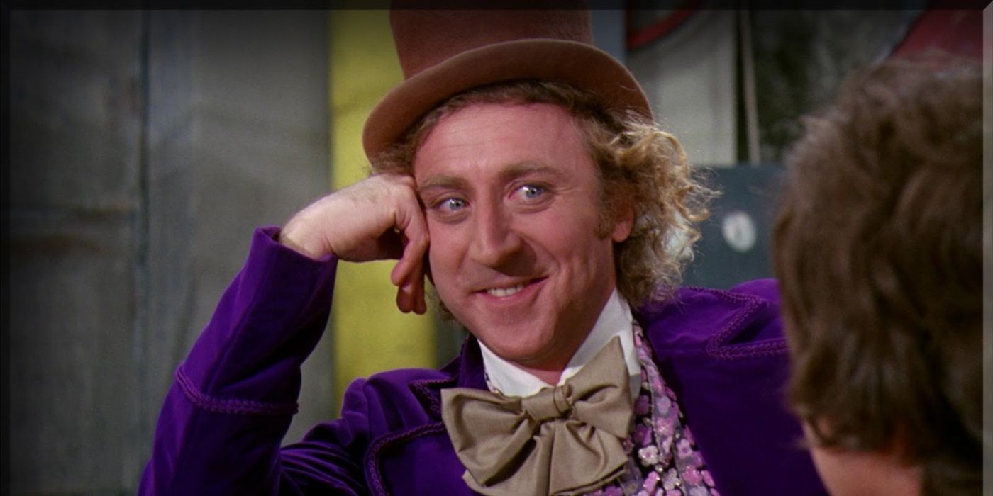 Willy Wonka smiles at a child off-screen in ``Willy Wonka and the Chocolate Factory.''