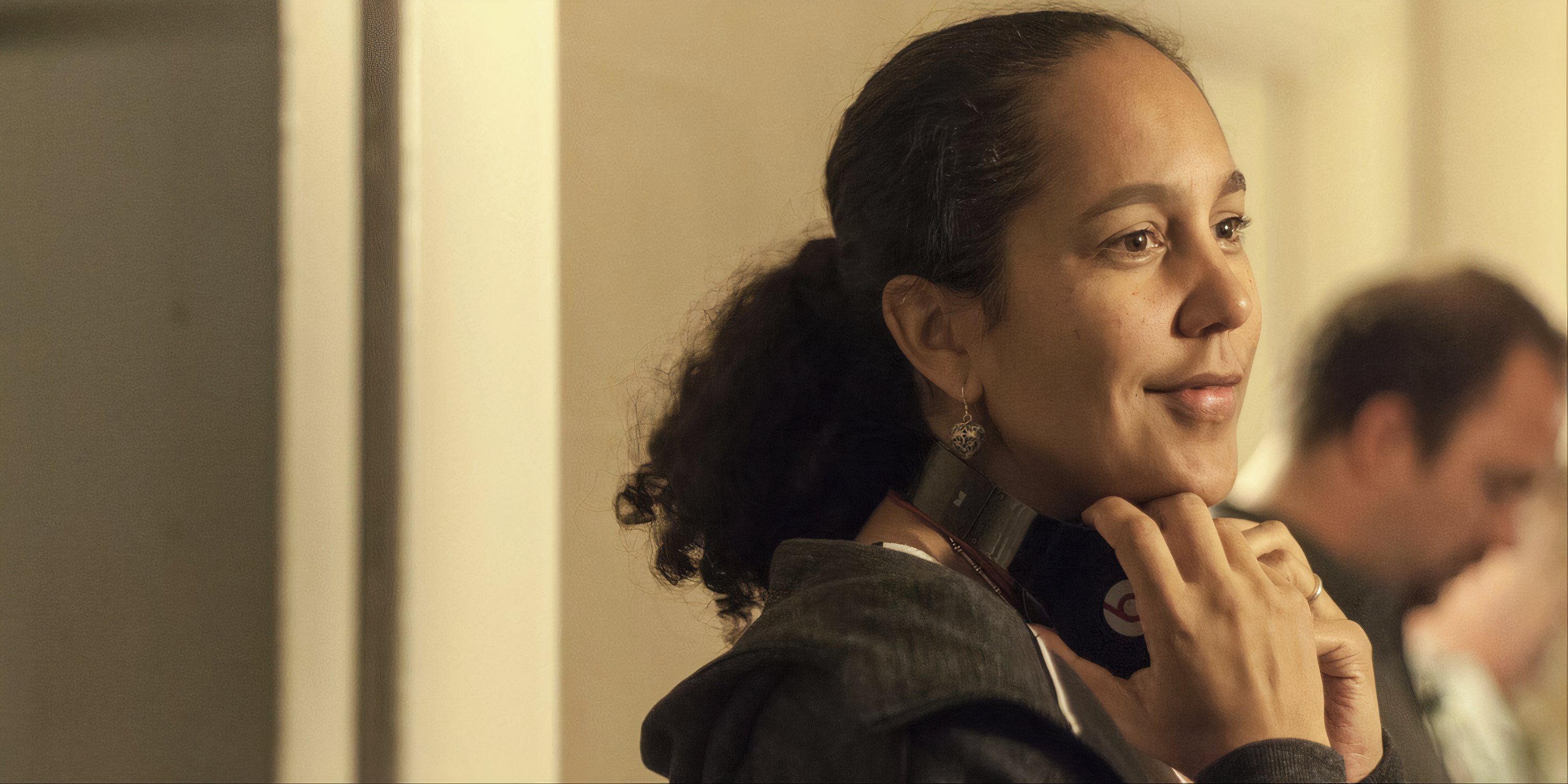 Gina Prince-Bythewood looking at something off-camera.