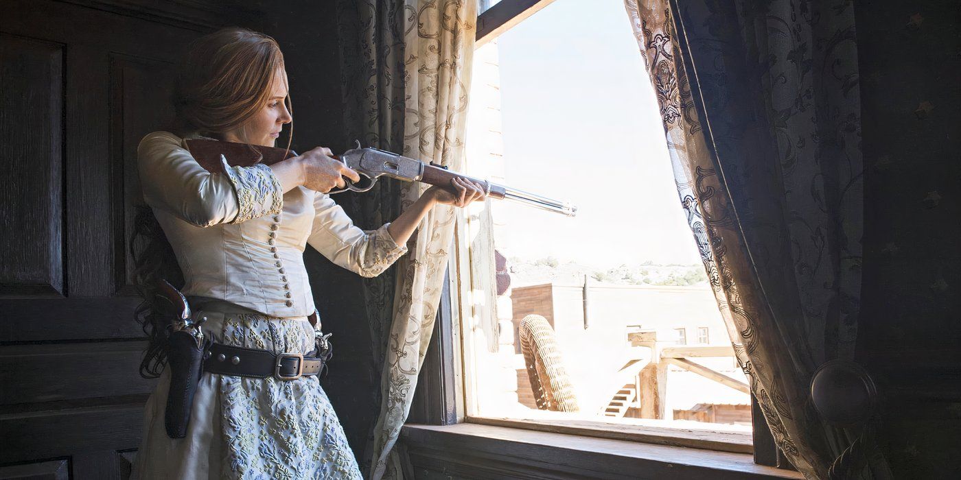 Christiane Seidel as Martha, pointing a rifle out of a window in Godless