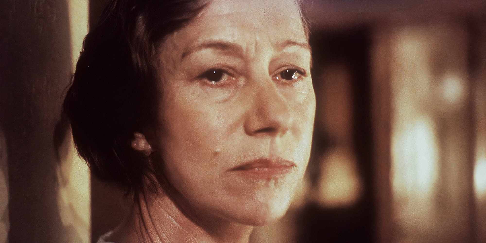 Helen Mirren as Mrs. Wilson with a sad expression in Gosford Park.
