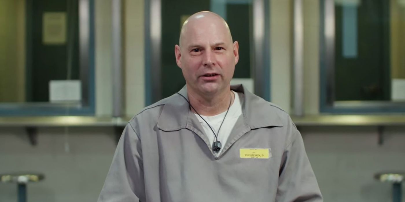 A man sitting down to be interviewed wearing a prison jumpsuit in I Am a Stalker.