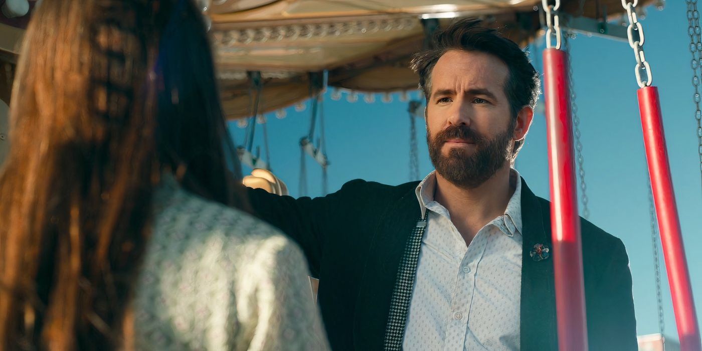 Ryan Reynolds as Cal, standing between carousel swings.