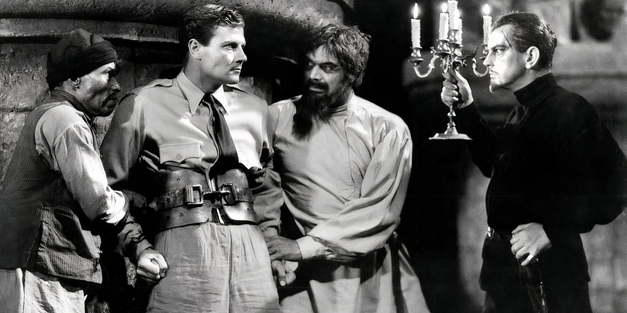 Leslie Banks as Count Zaroff imprisoning John McCrea as Bob in The Most Dangerous Game 1932.