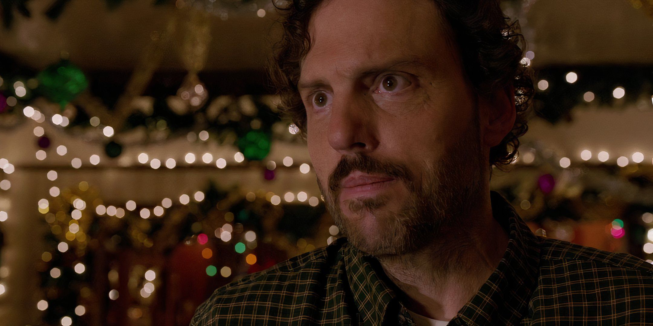 close-up of Silas Weir Mitchell as Monroe in Grimm looking off camera with lights behind him