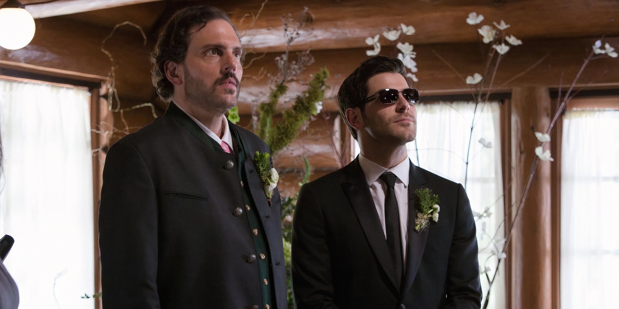 Silas Weir Mitchell as Monroe and David Giuntoli as Nick Burkhardt at a wedding in Grimm.